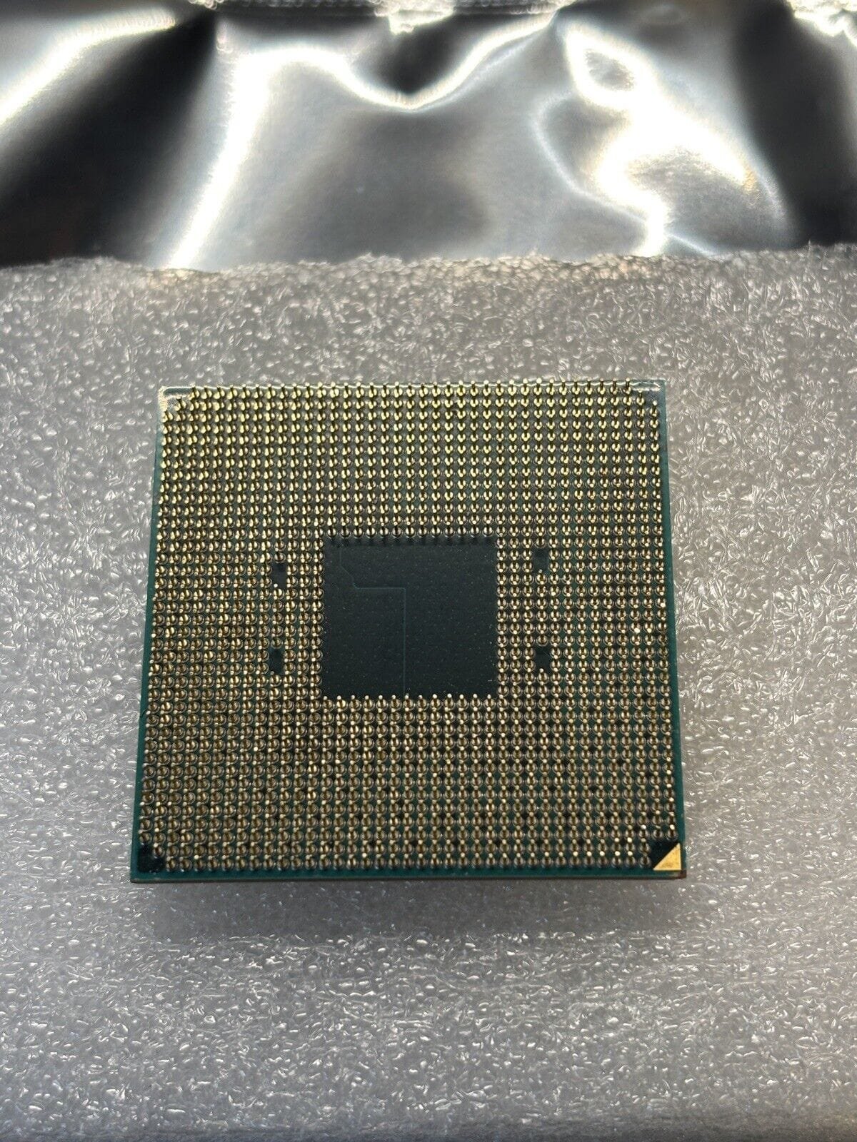 Picture of the underside of an amd cpu
